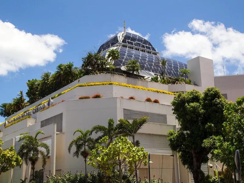 The Reef Hotel Casino in Cairns with the glass Wildlife Dome on its roof and tropical planting
